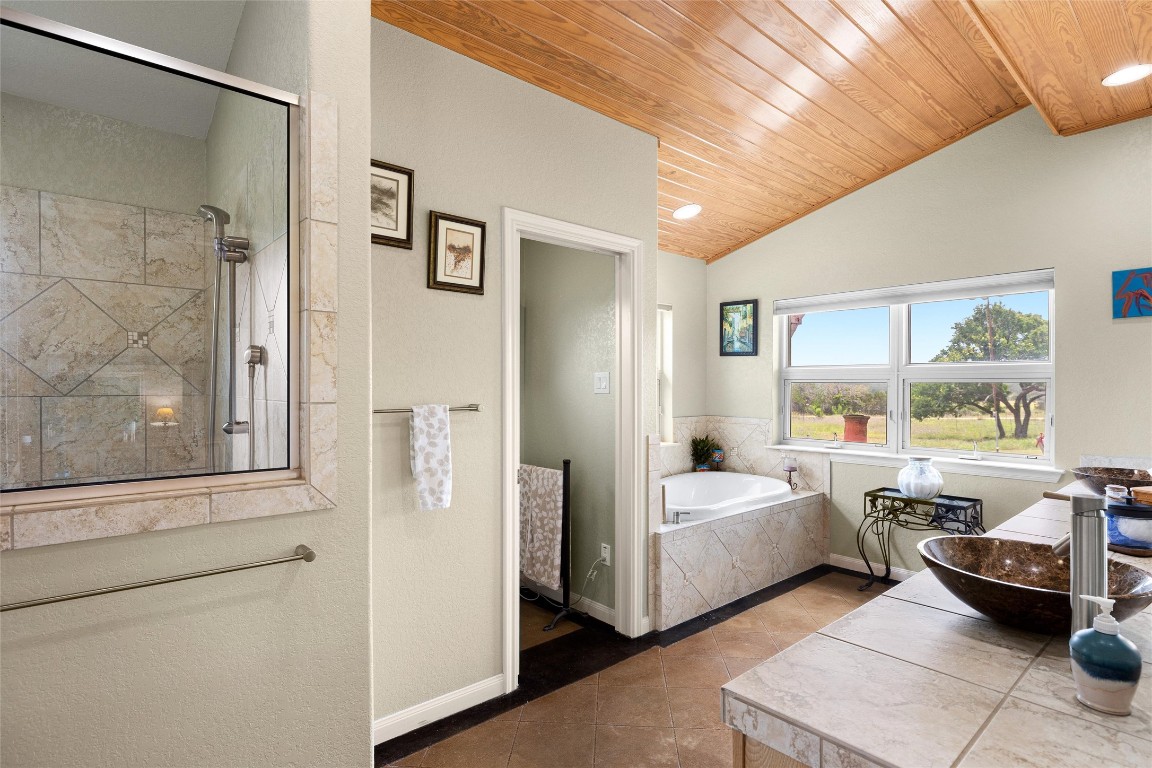 426 Preiss Ranch Road Blanco, TX 78606 - Photo 22 of 40 a bedroom with furniture and a large window