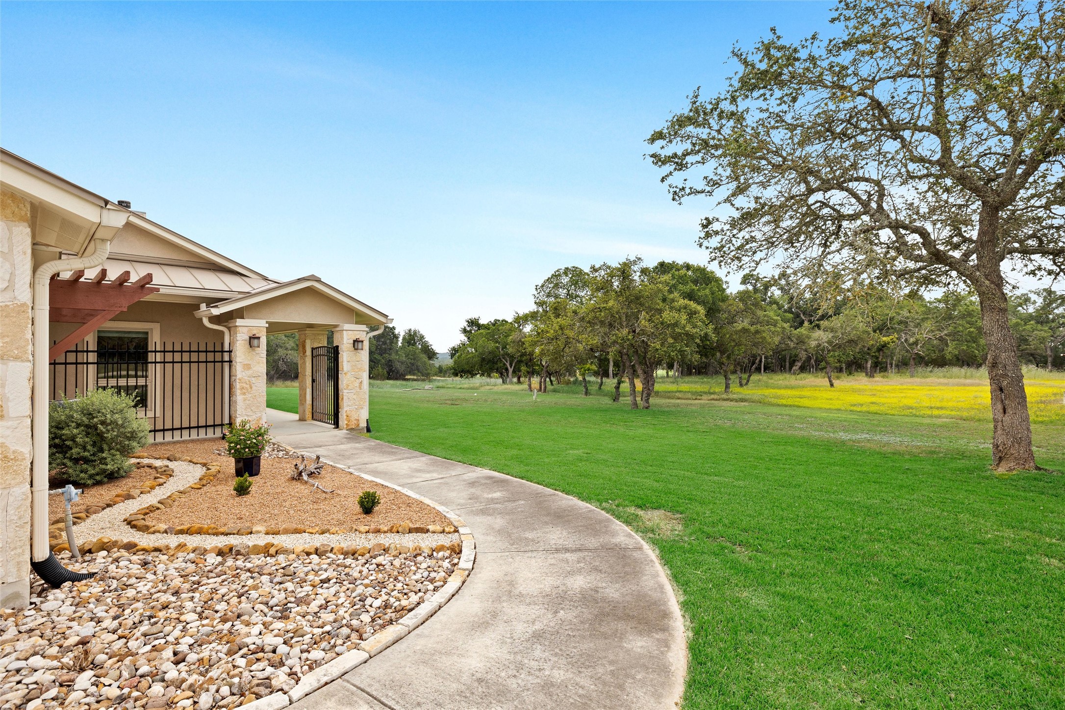 426 Preiss Ranch Road Blanco, TX 78606 - Photo 5 of 40 a front view of a house with garden