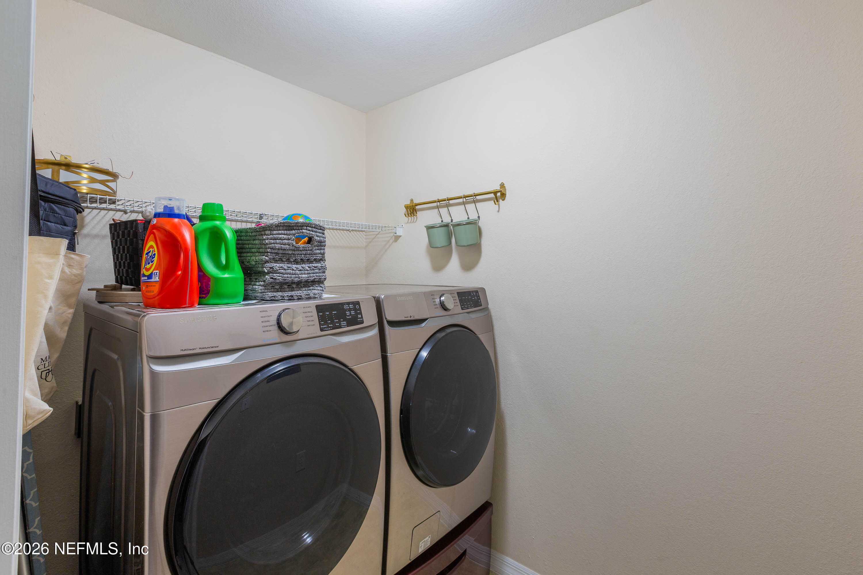 10961 Burnt Mill Road, Unit 734 Jacksonville, FL 32256 - Photo 23 of 35 a utility room with dryer and washer