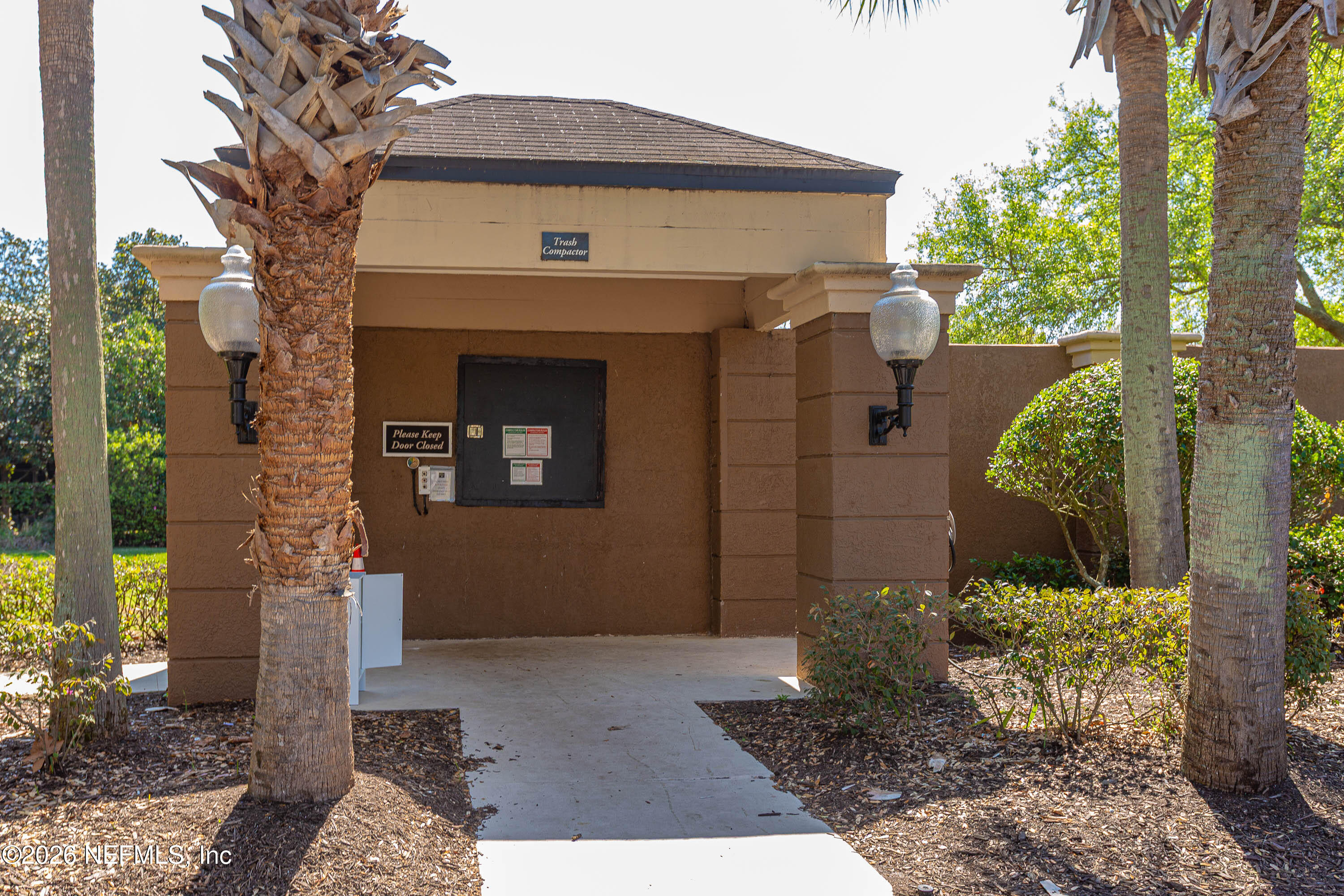 10961 Burnt Mill Road, Unit 734 Jacksonville, FL 32256 - Photo 25 of 35 a front view of a house with garden