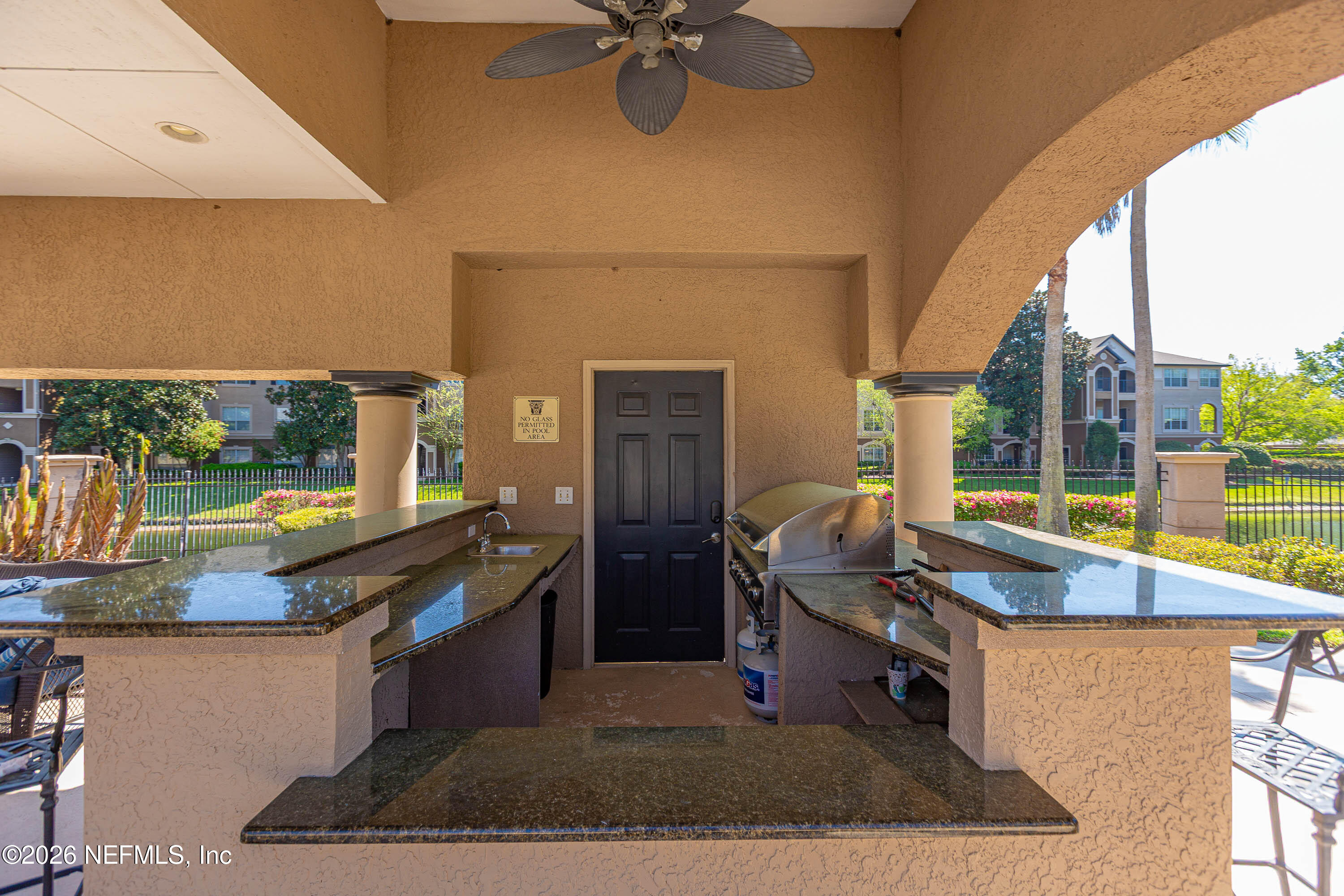 10961 Burnt Mill Road, Unit 734 Jacksonville, FL 32256 - Photo 30 of 35 a kitchen with a sink and a stove top oven