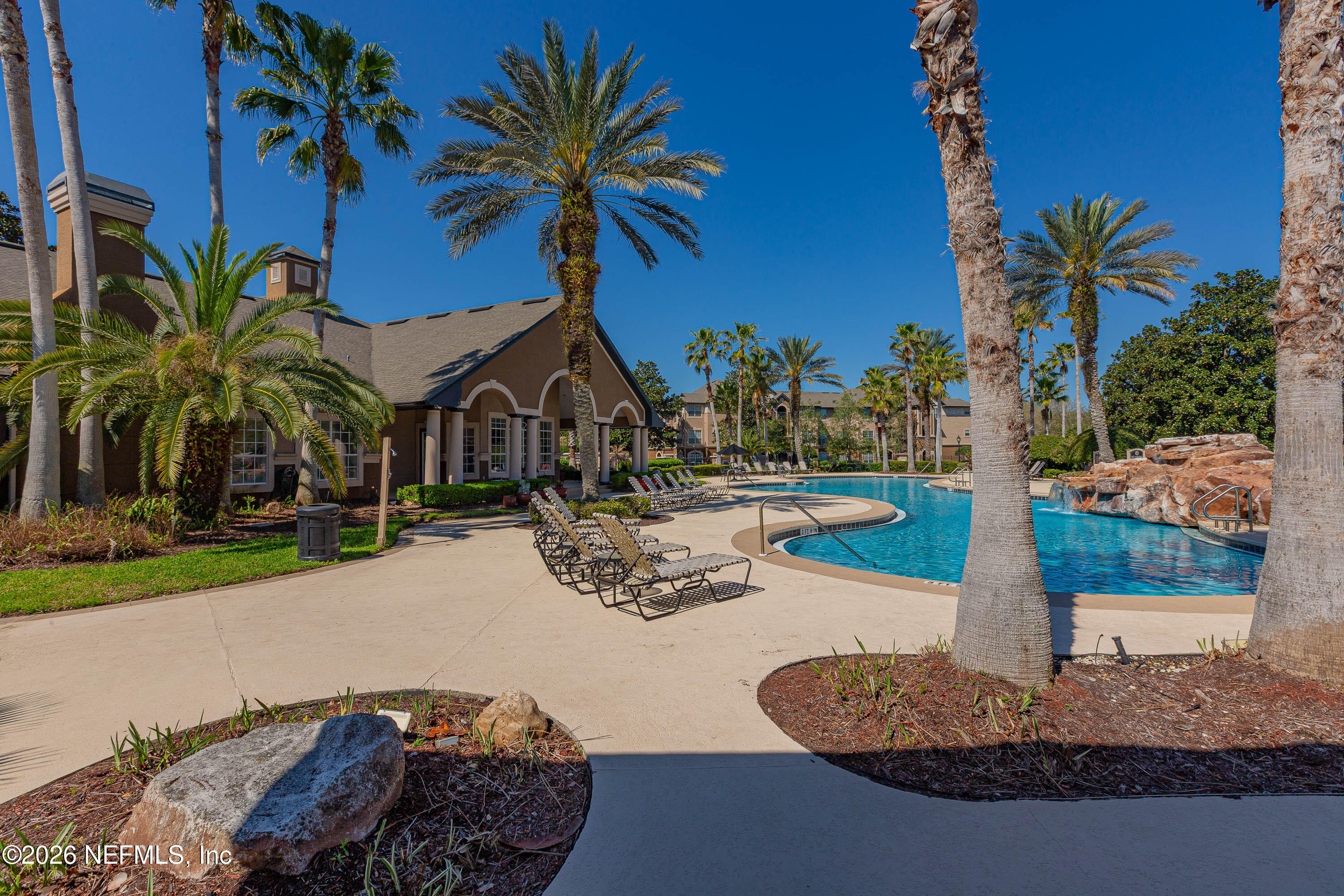 10961 Burnt Mill Road, Unit 734 Jacksonville, FL 32256 - Photo 31 of 35 a front view of a house with garden and patio