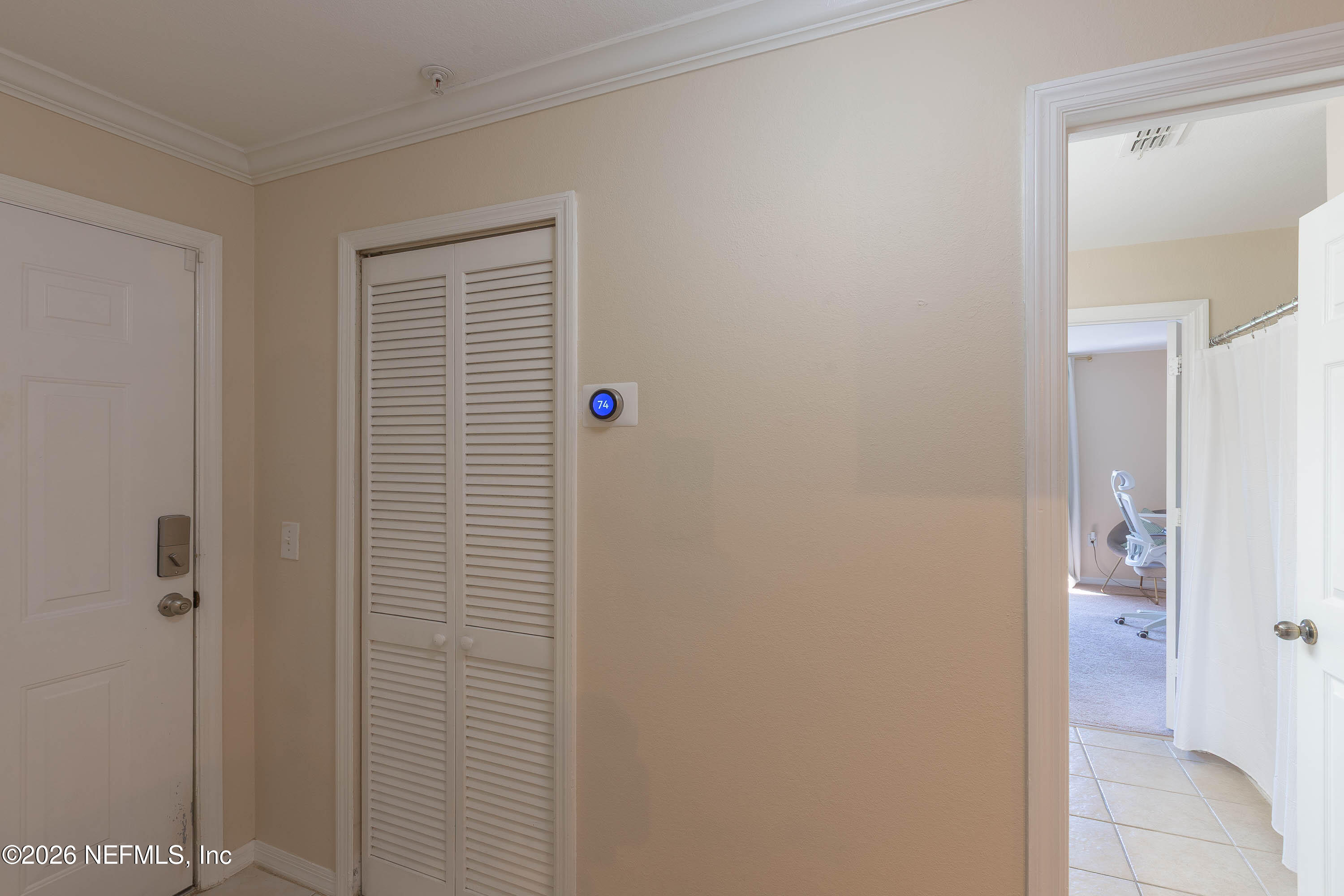 10961 Burnt Mill Road, Unit 734 Jacksonville, FL 32256 - Photo 5 of 35 a view of a bathroom from a hallway