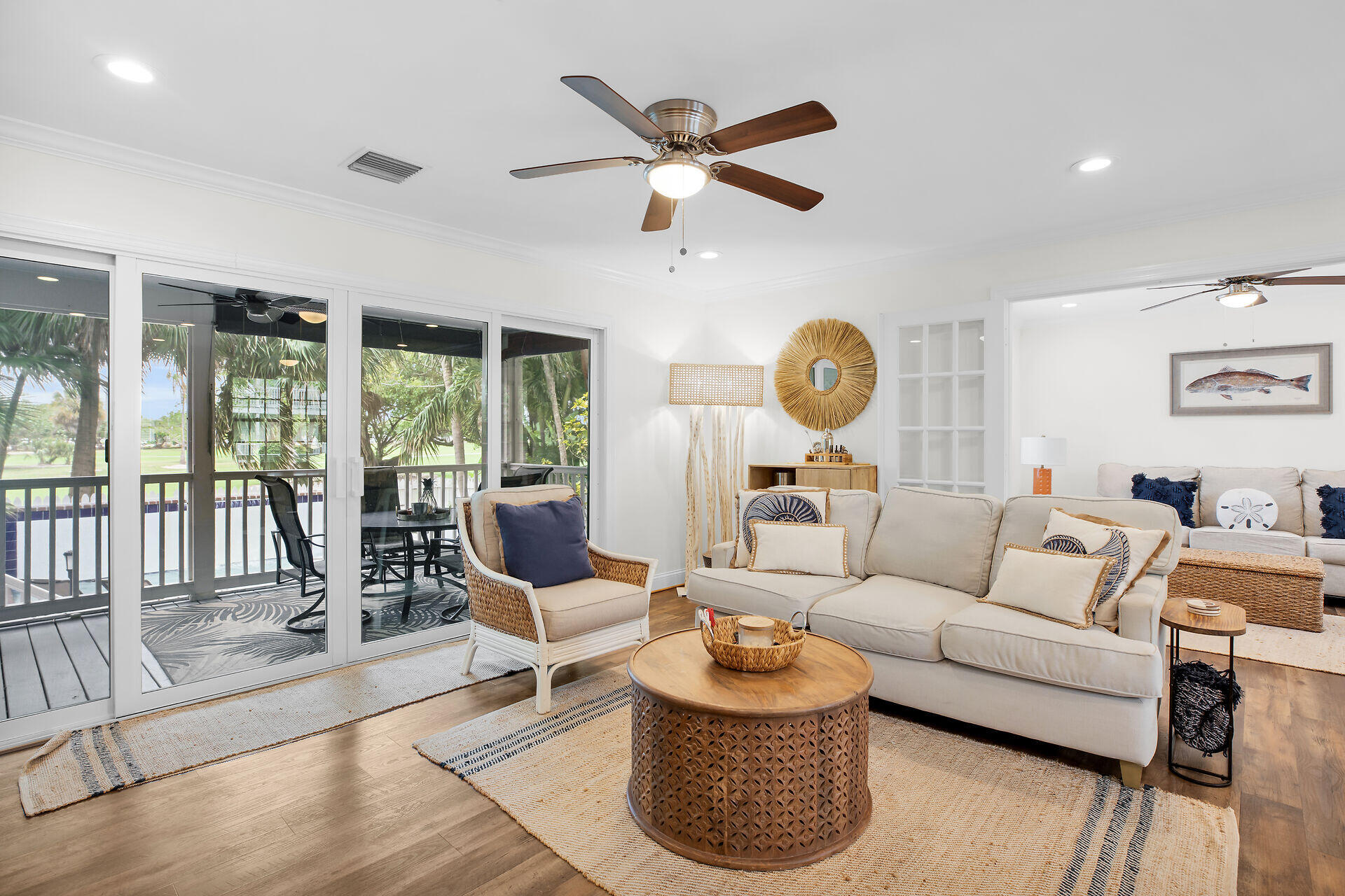 60 Golf Club Drive Key West, FL 33040 - Photo 18 of 42 a living room with furniture a rug potted plant and a large window