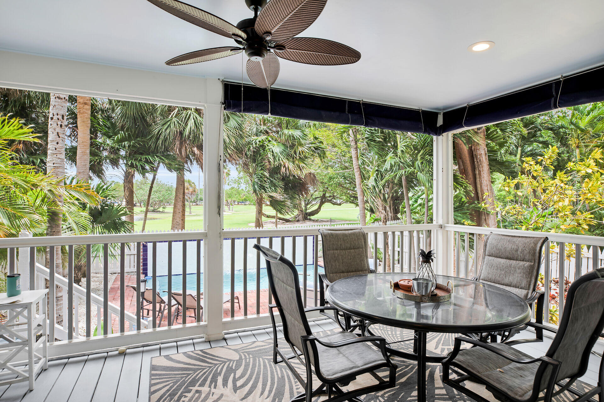 60 Golf Club Drive Key West, FL 33040 - Photo 19 of 42 a view of a dining room with furniture window and outside view