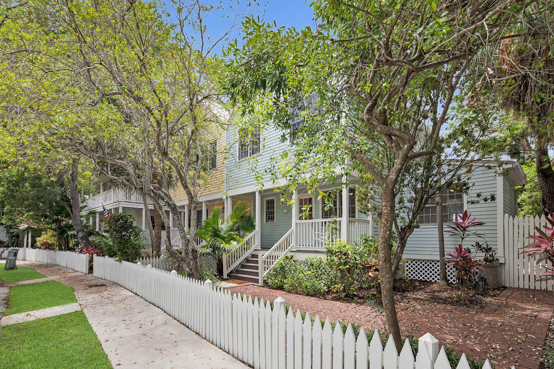 60 Golf Club Drive Key West, FL 33040 - Photo 2 of 42 a front view of a house with a garden