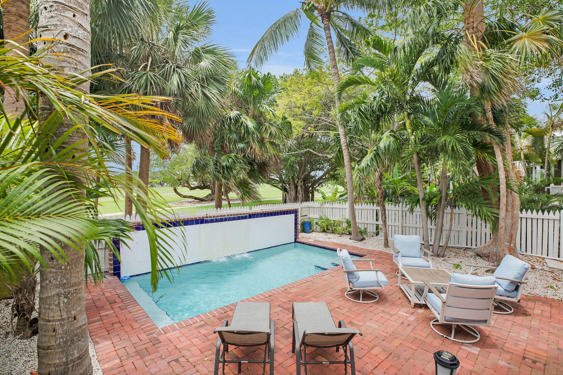 60 Golf Club Drive Key West, FL 33040 - Photo 21 of 42 a view of a backyard with swimming pool and sitting area