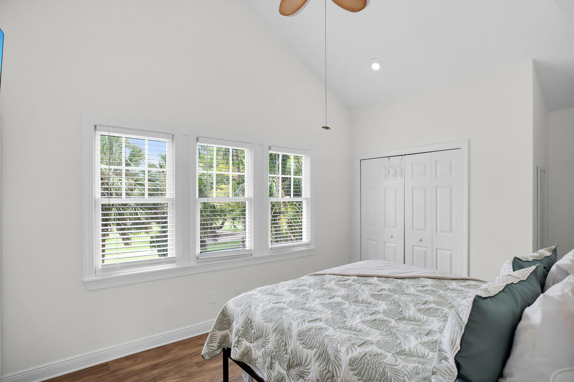 60 Golf Club Drive Key West, FL 33040 - Photo 23 of 42 a bedroom with a bed window and wooden floor