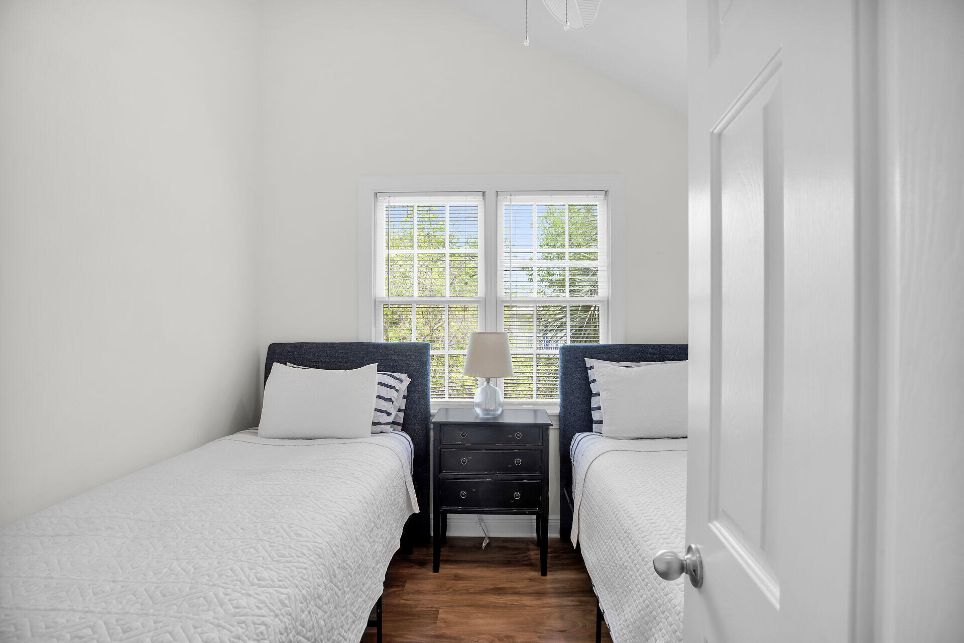 60 Golf Club Drive Key West, FL 33040 - Photo 26 of 42 a bedroom with a bed and wooden floor