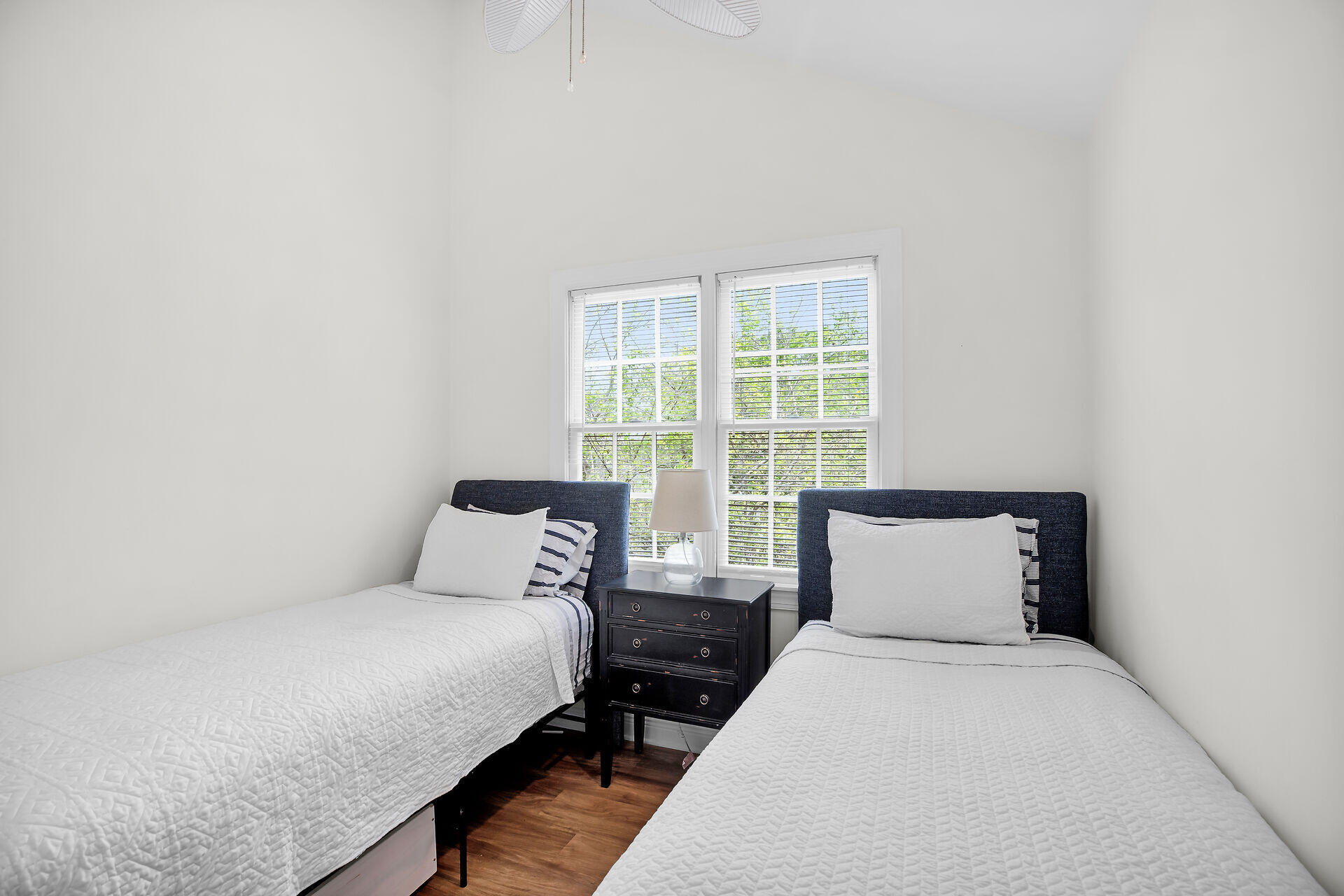 60 Golf Club Drive Key West, FL 33040 - Photo 27 of 42 a bedroom with a bed and wooden floor