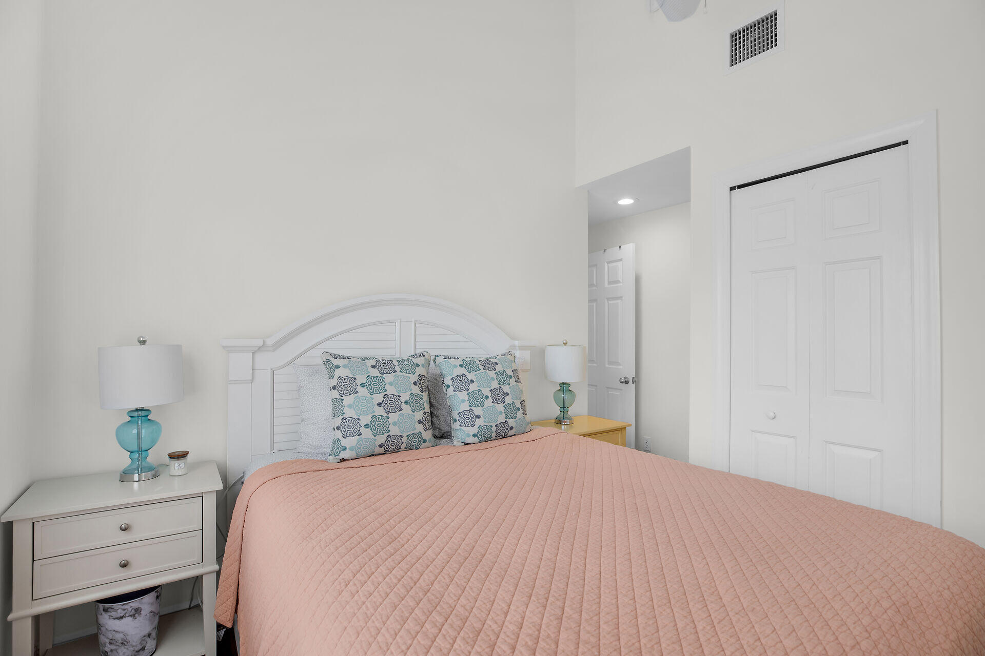 60 Golf Club Drive Key West, FL 33040 - Photo 31 of 42 a bedroom with a bed and a potted plant