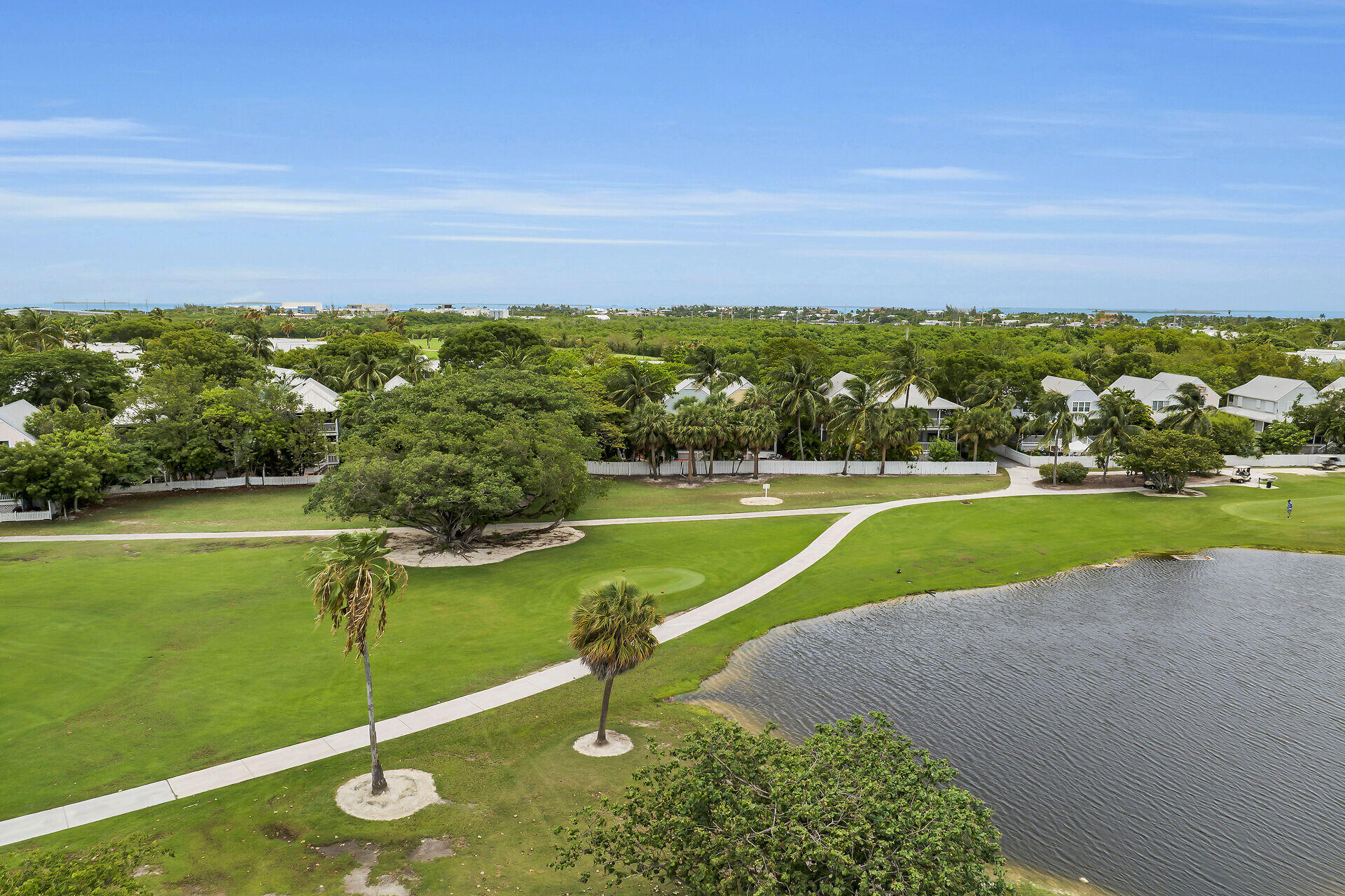 60 Golf Club Drive Key West, FL 33040 - Photo 36 of 42 a view of a lake with a big yard