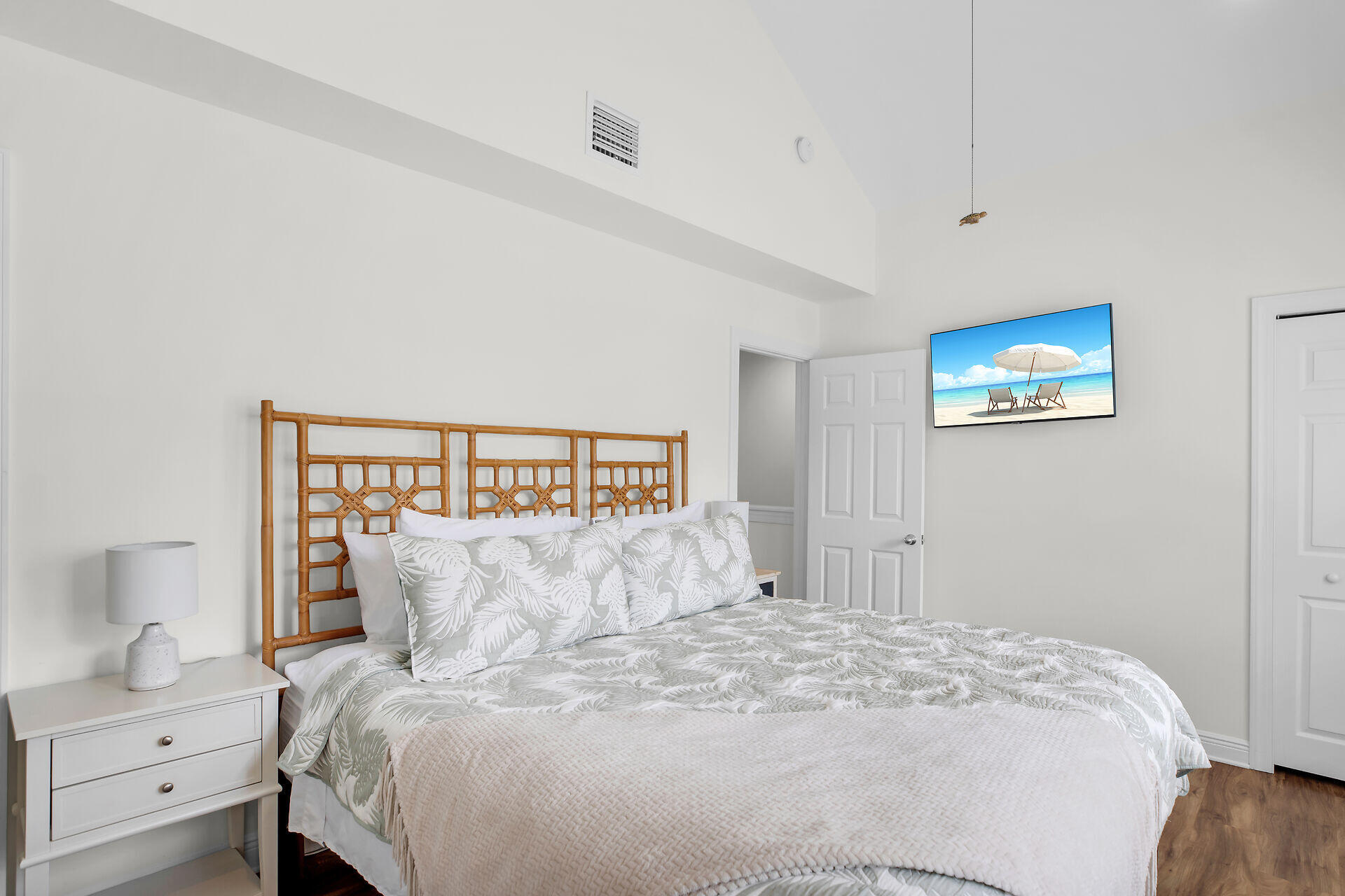 60 Golf Club Drive Key West, FL 33040 - Photo 38 of 42 a bedroom with a large bed and a night stand