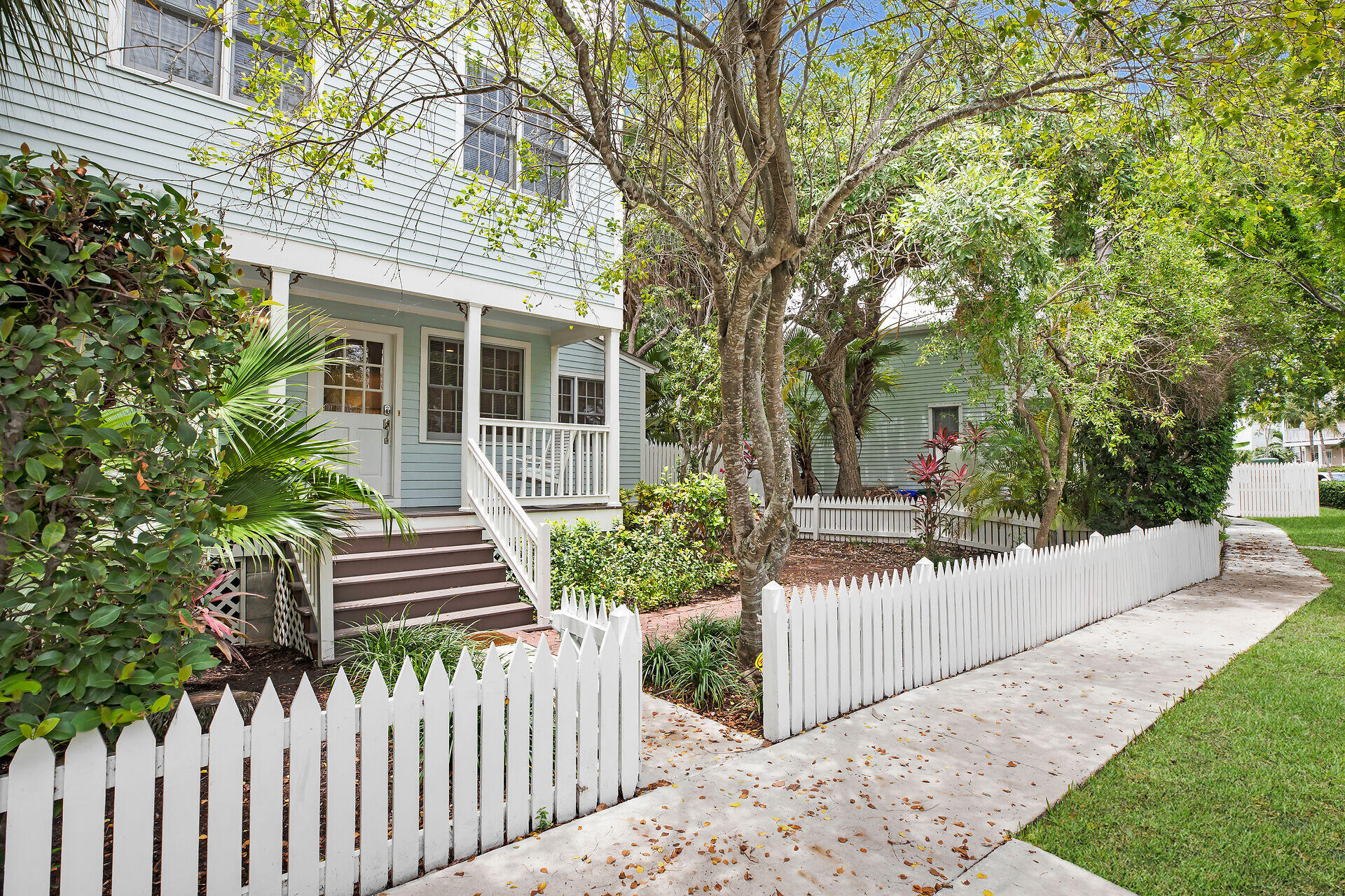 60 Golf Club Drive Key West, FL 33040 - Photo 5 of 42 a front view of a house with a garden