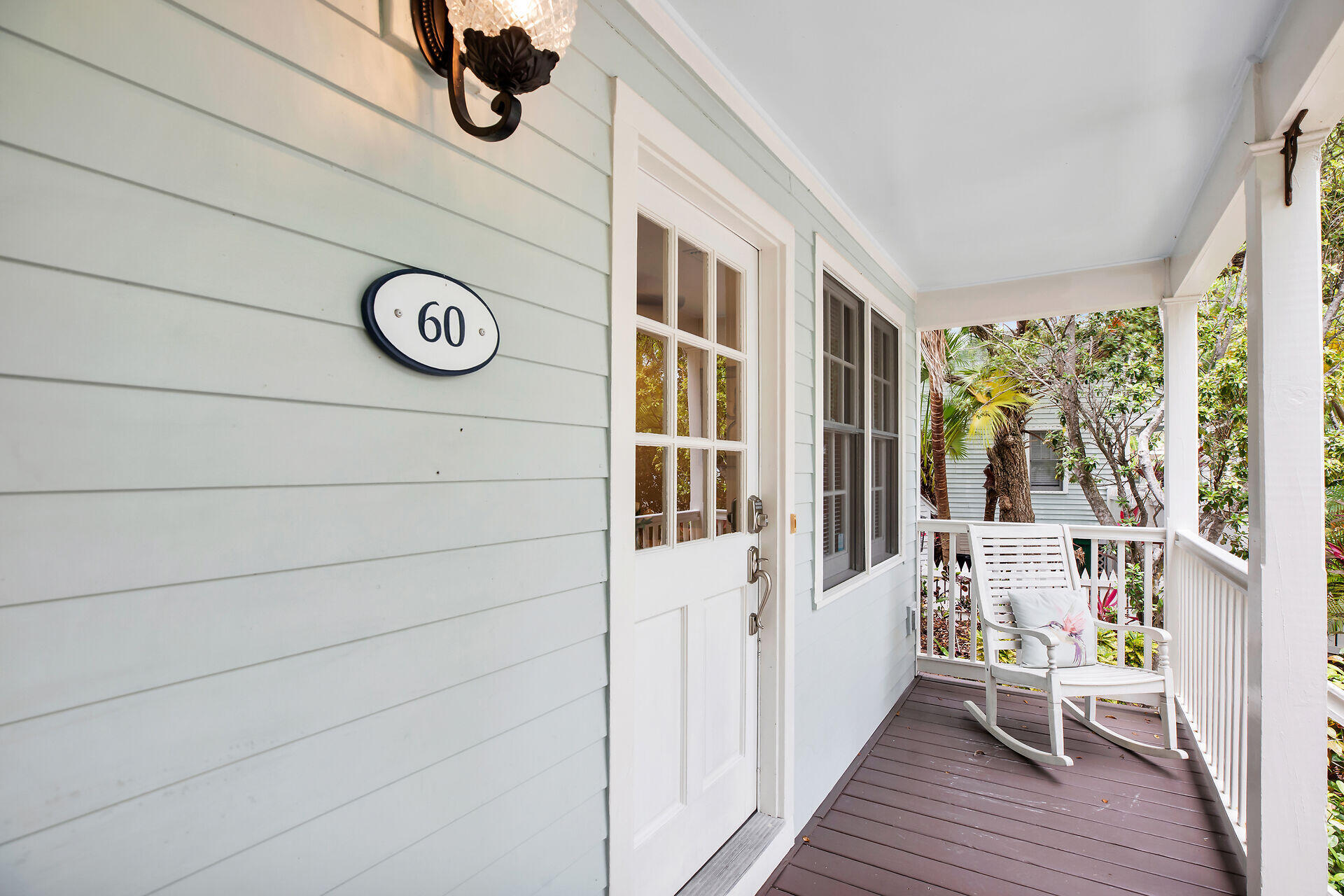60 Golf Club Drive Key West, FL 33040 - Photo 6 of 42 a hallway with a large window and wooden floor