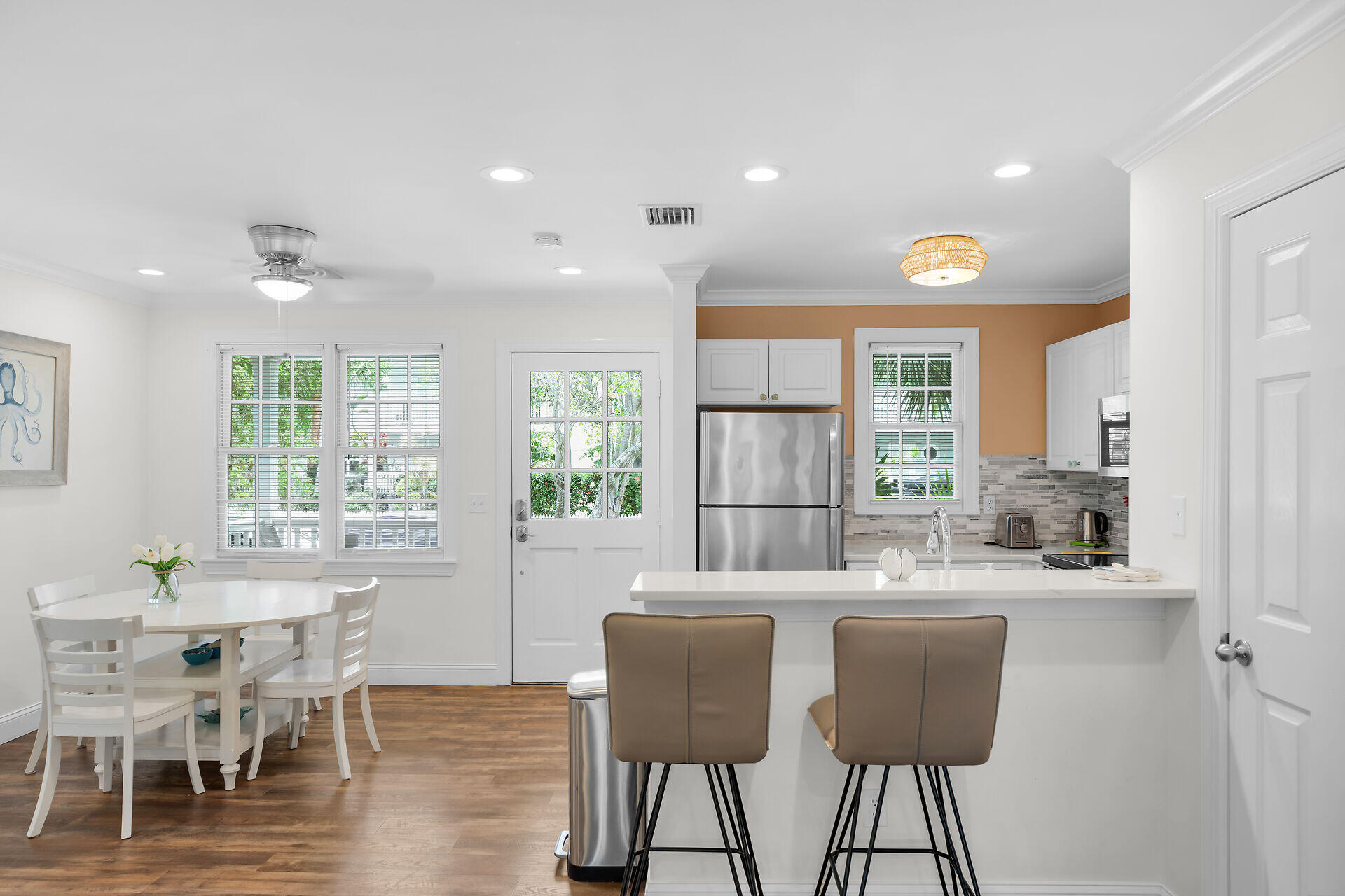 60 Golf Club Drive Key West, FL 33040 - Photo 9 of 42 a dining room with furniture and wooden floor