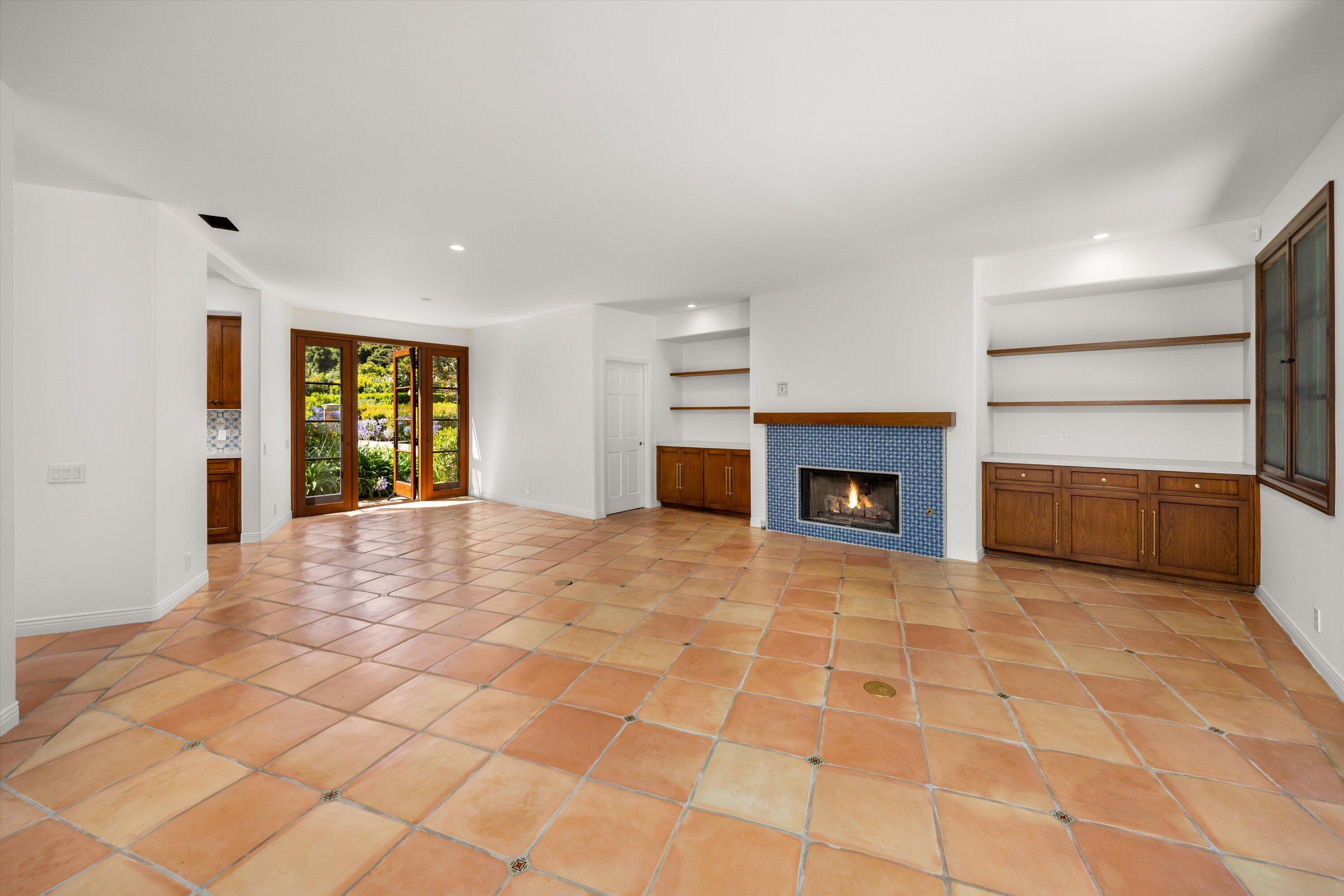 342 Sheffield Drive Montecito, CA 93108 - Photo 15 of 46 a big room with windows and a fireplace