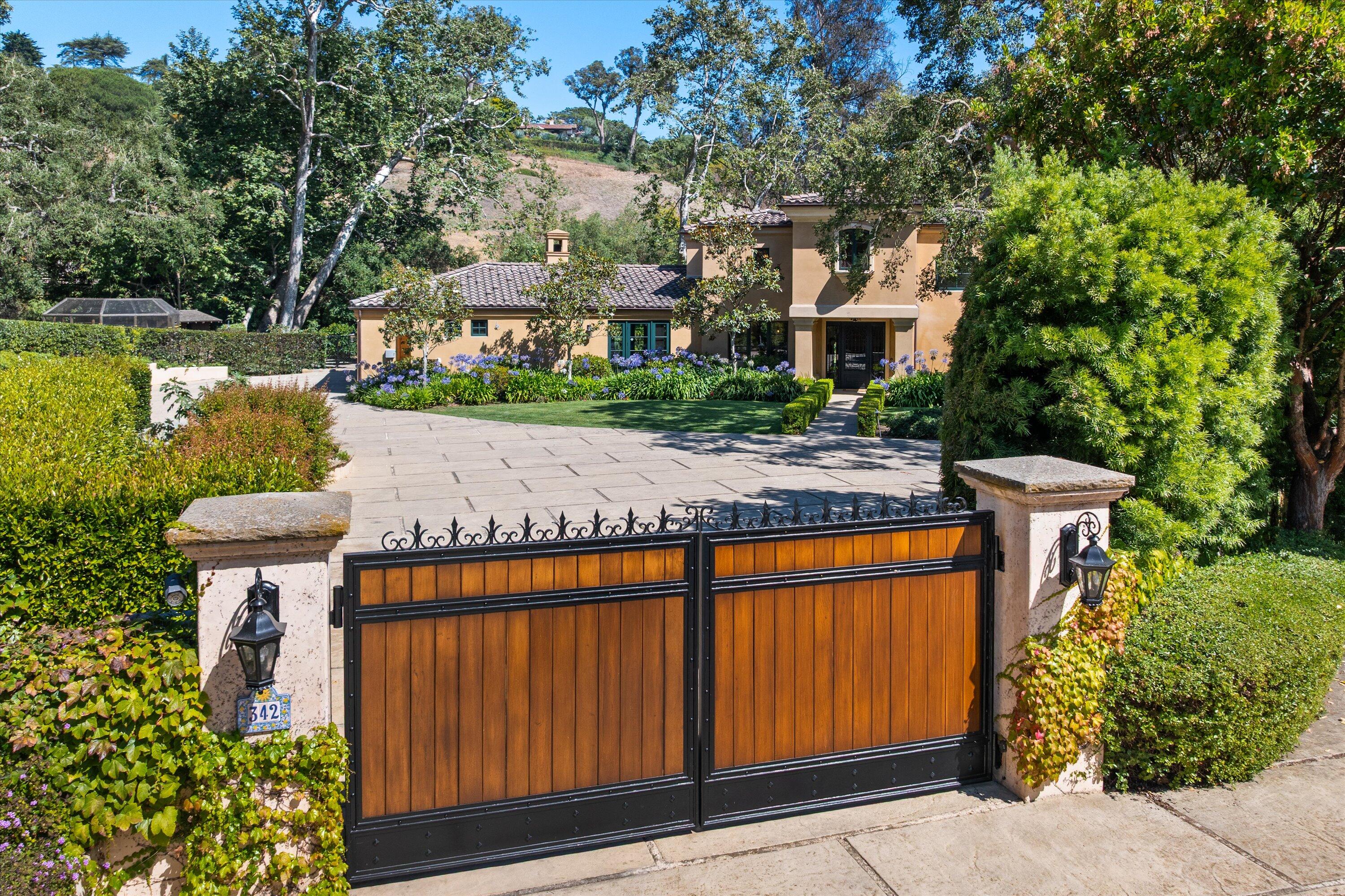 342 Sheffield Drive Montecito, CA 93108 - Photo 2 of 46 a view of a yard with plants and large tree