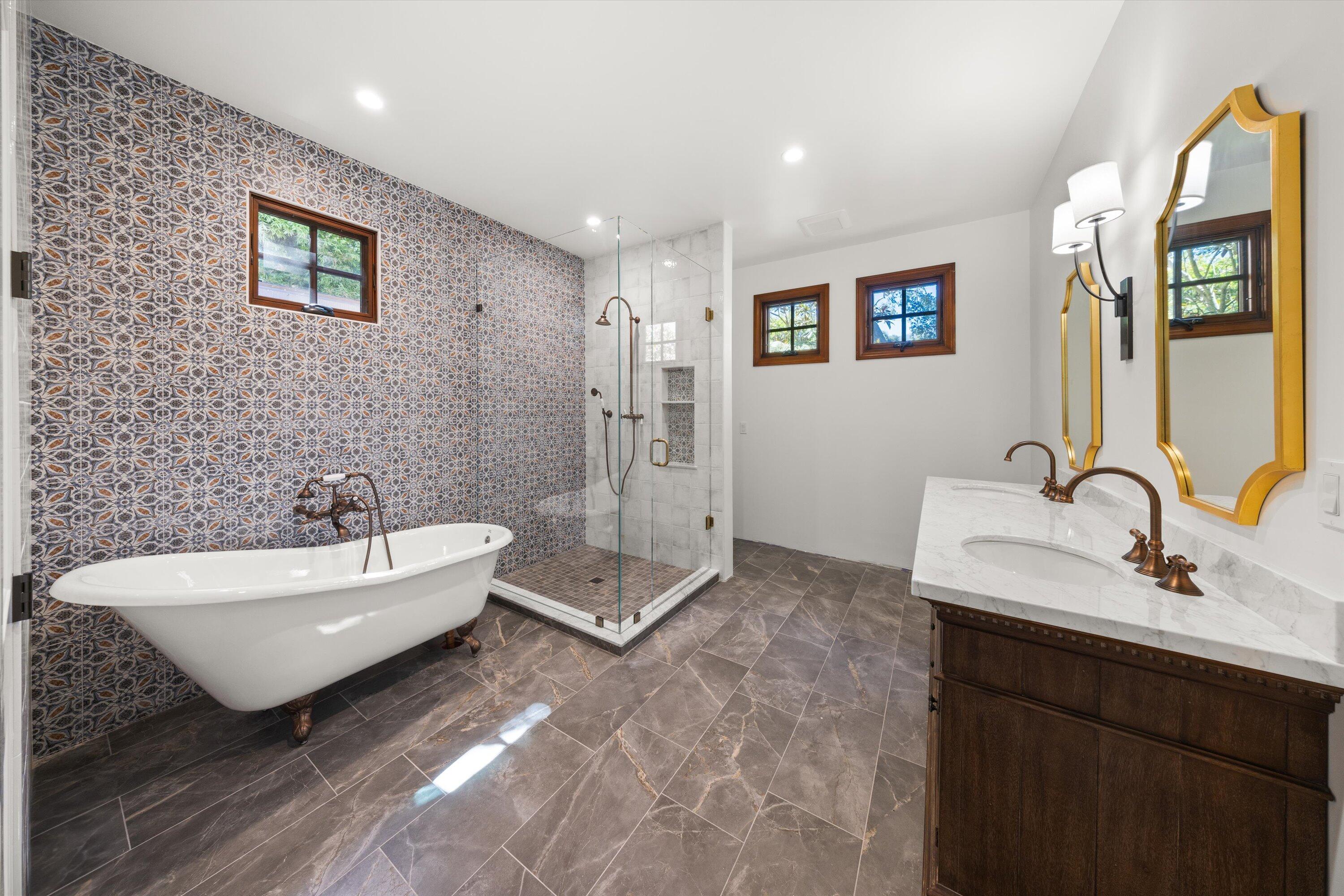 342 Sheffield Drive Montecito, CA 93108 - Photo 21 of 46 a spacious bathroom with a double vanity sink a mirror and a bathtub