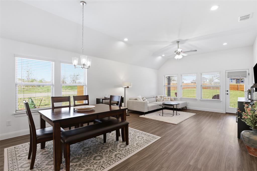 1101 Springfield Road Springtown, TX 76082 - Photo 12 of 32 a view of a dining room with furniture window and wooden floor