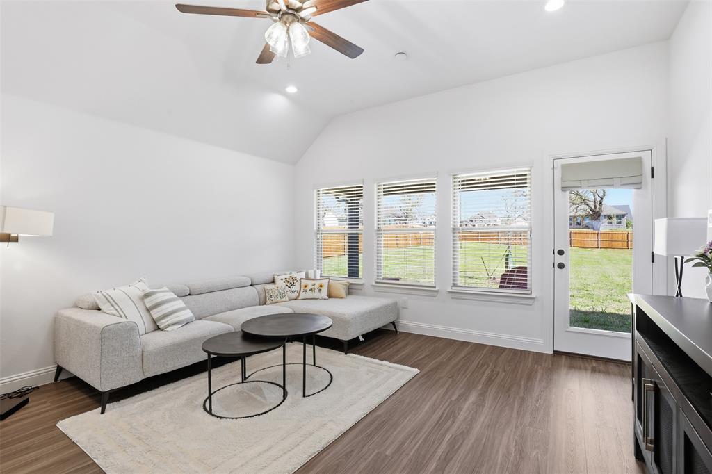 1101 Springfield Road Springtown, TX 76082 - Photo 16 of 32 a living room with furniture and a wooden floor