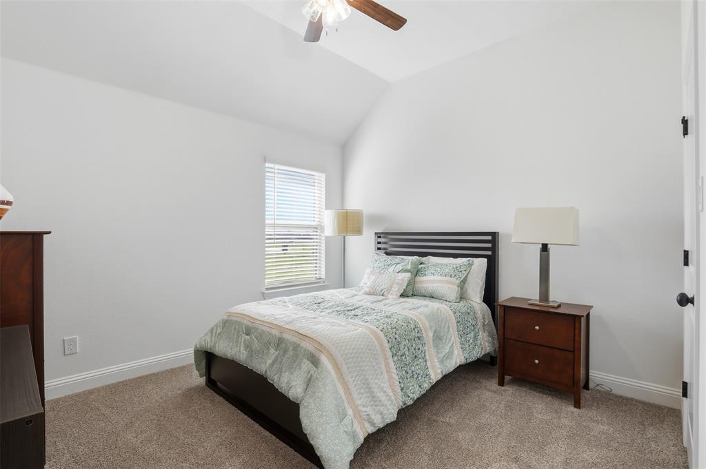 1101 Springfield Road Springtown, TX 76082 - Photo 25 of 32 a bedroom with a bed and a night stand