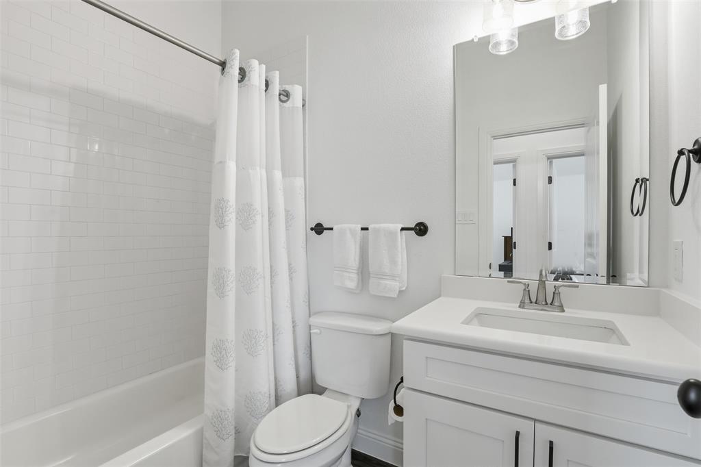 1101 Springfield Road Springtown, TX 76082 - Photo 26 of 32 a bathroom with a sink a toilet and shower