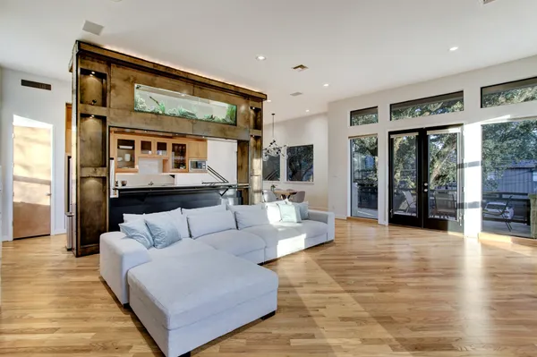 a living room with furniture and wooden floor
