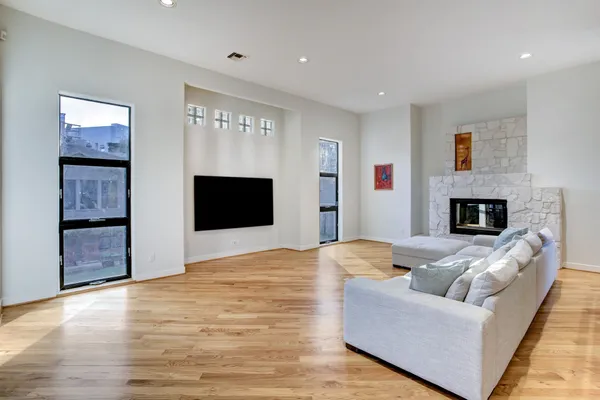 a living room with furniture and a fireplace