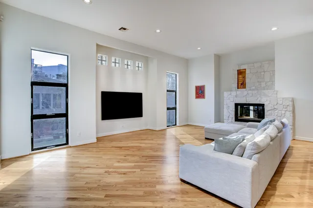 a living room with furniture and a fireplace
