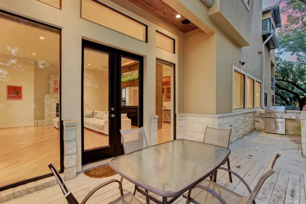 a view of a living room and a balcony