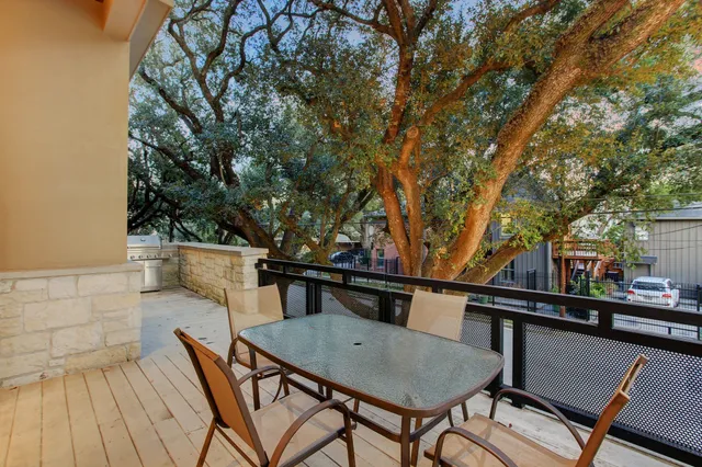 a view of a chairs and table on the deck