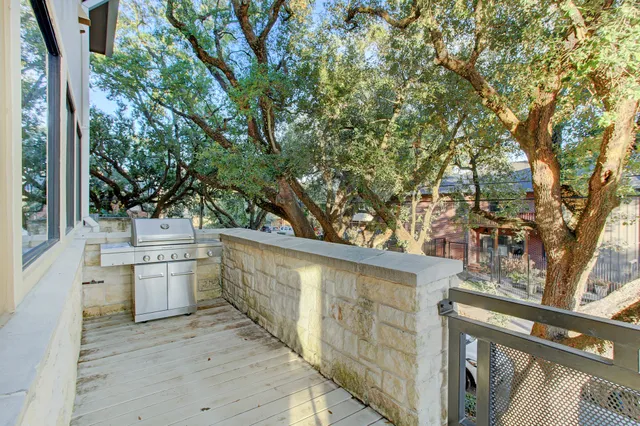 a view of a hardwood and floor to ceiling window