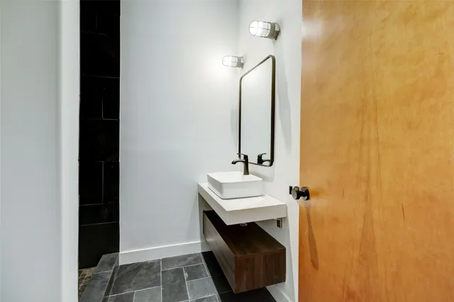 a bathroom with a sink and a mirror