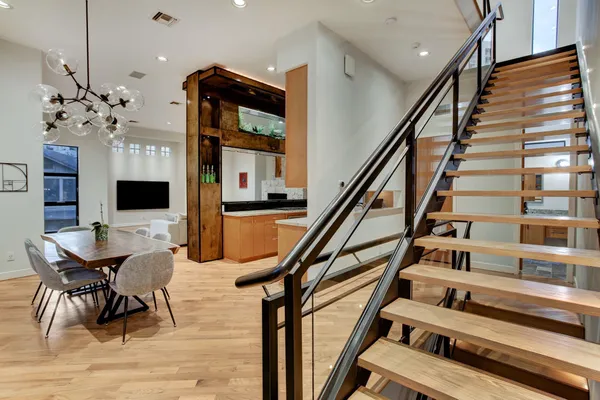 a view of a livingroom with furniture staircase and a living room