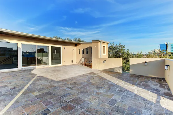 a view of a house with a backyard