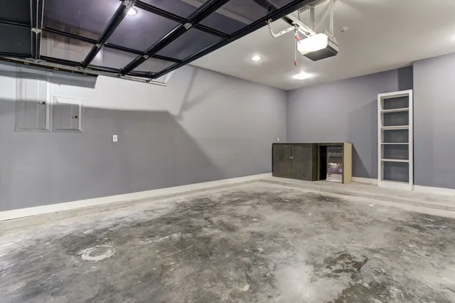 a view of an empty room with a fireplace and a window