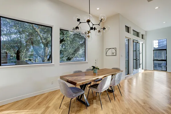 a view of a dining room with furniture window and wooden floor