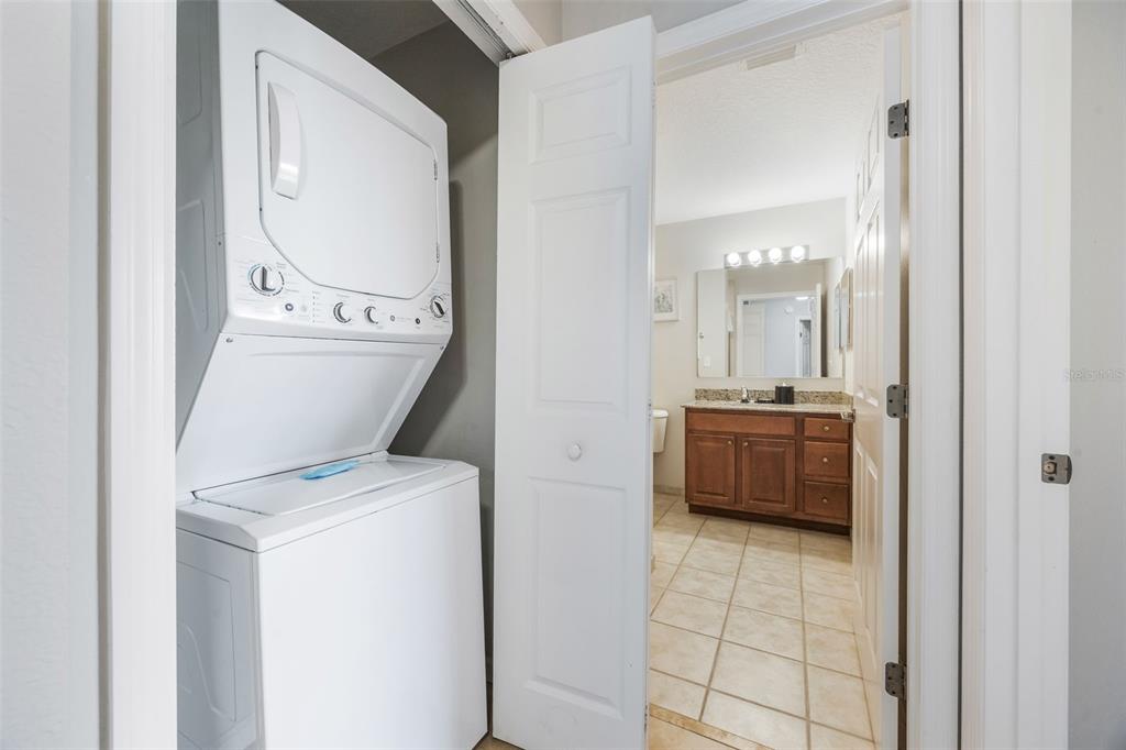 8774 Worldquest Boulevard, Unit 7404 Orlando, FL 32821 - Photo 26 of 55 a utility room with dryer and washer
