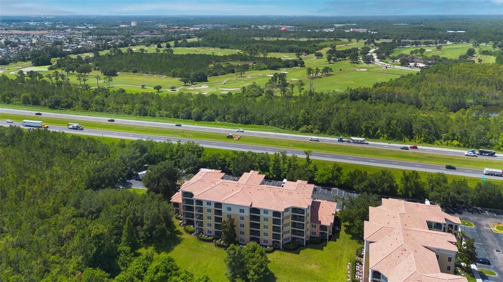 8774 Worldquest Boulevard, Unit 7404 Orlando, FL 32821 - Photo 30 of 55 an aerial view of a house with a yard basket ball court and outdoor seating