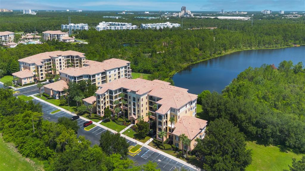 8774 Worldquest Boulevard, Unit 7404 Orlando, FL 32821 - Photo 32 of 55 an aerial view of a house with a lake view