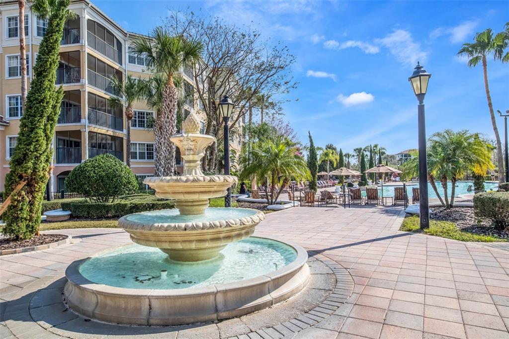 8774 Worldquest Boulevard, Unit 7404 Orlando, FL 32821 - Photo 42 of 55 a view of a swimming pool with a patio