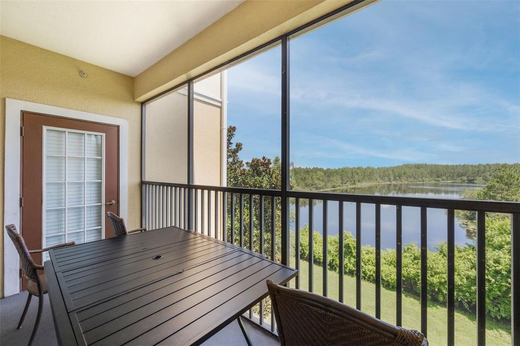 8774 Worldquest Boulevard, Unit 7404 Orlando, FL 32821 - Photo 49 of 55 a view of a balcony with wooden floor