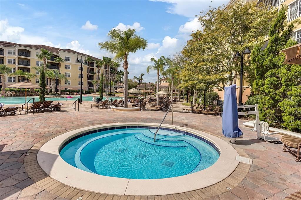 8774 Worldquest Boulevard, Unit 7404 Orlando, FL 32821 - Photo 54 of 55 a view of a swimming pool with a patio