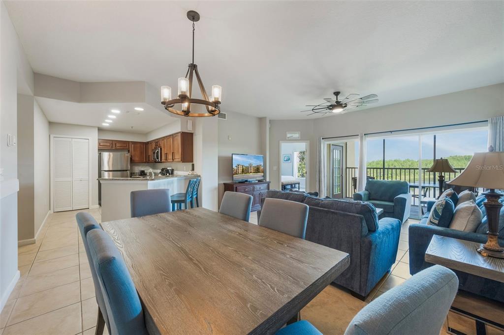 8774 Worldquest Boulevard, Unit 7404 Orlando, FL 32821 - Photo 9 of 55 a view of a dining room with furniture