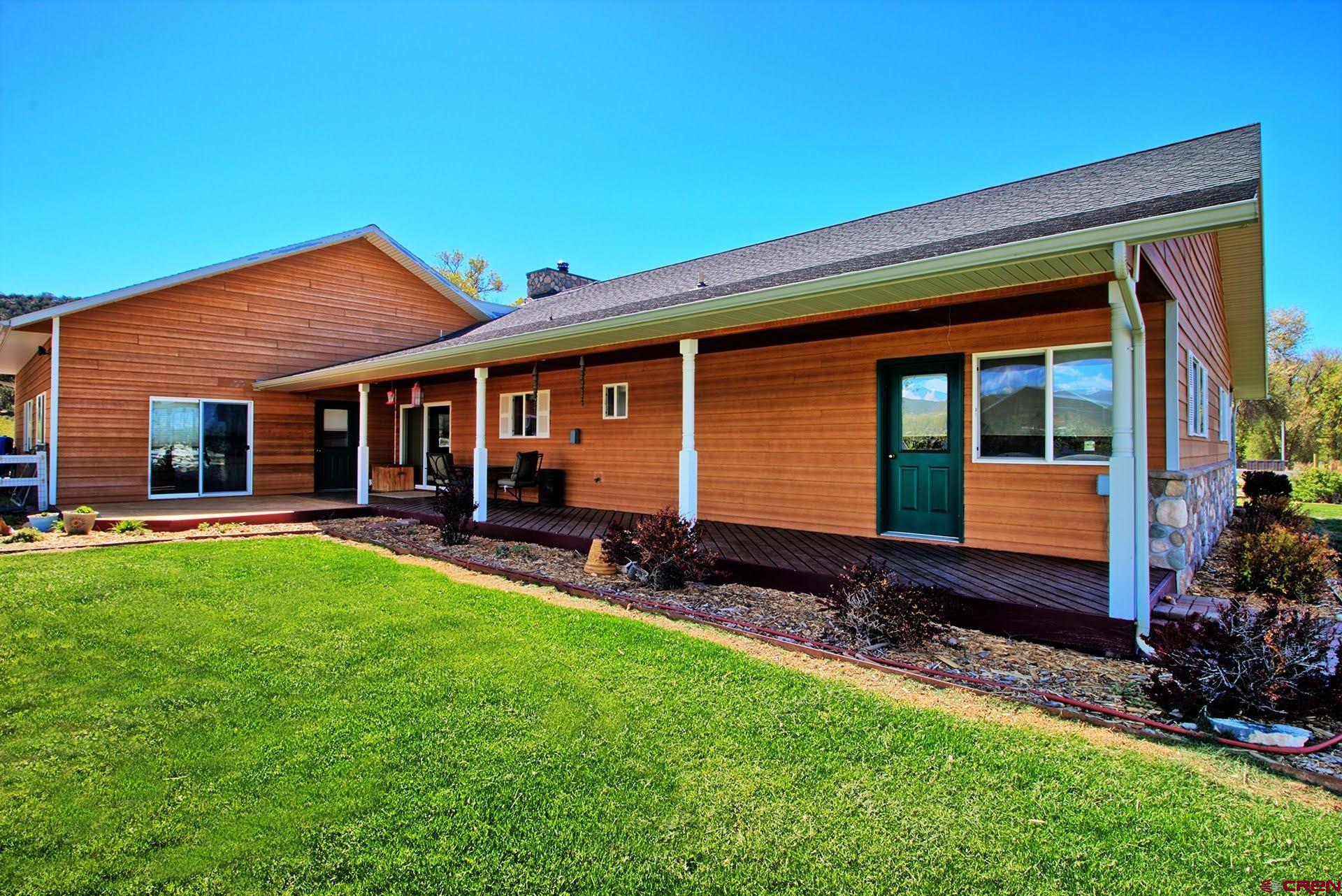1036 East Main Street Cedaredge, CO 81413 - Photo 11 of 36 a view of a house with backyard porch and garden