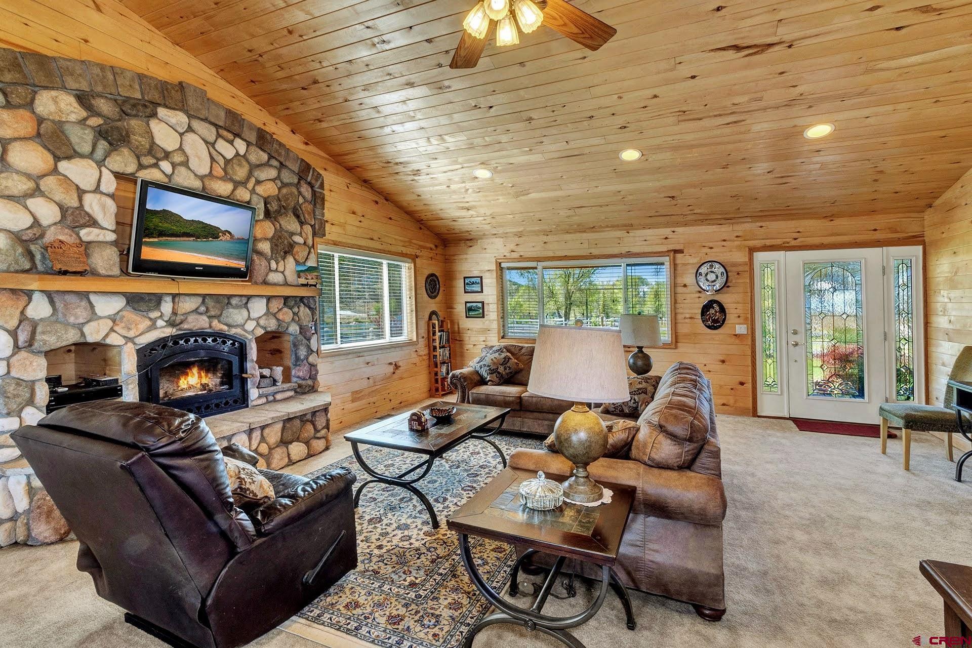 1036 East Main Street Cedaredge, CO 81413 - Photo 14 of 36 a living room with furniture and a fireplace