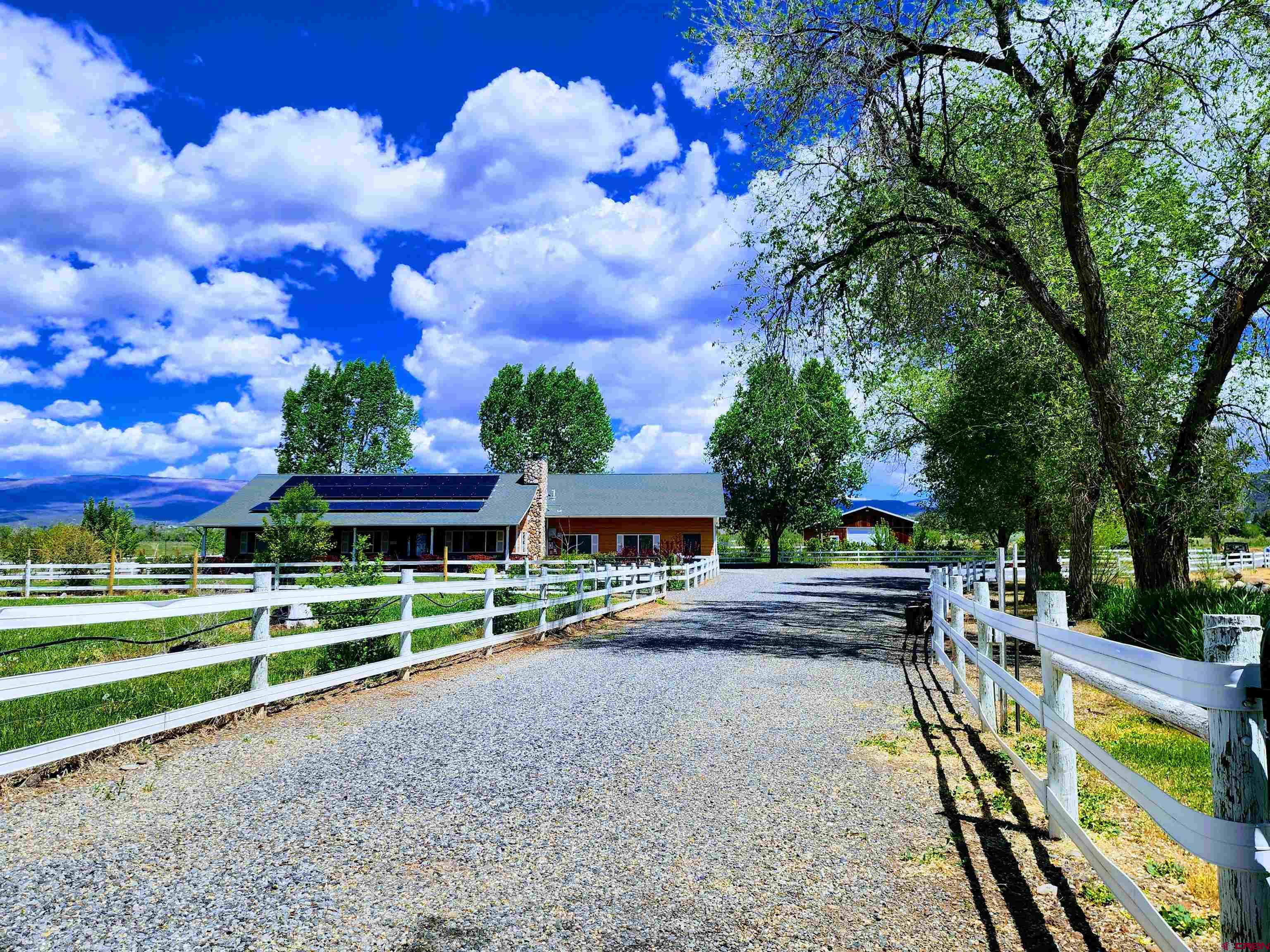 1036 East Main Street Cedaredge, CO 81413 - Photo 2 of 36 a view of a house with a yard