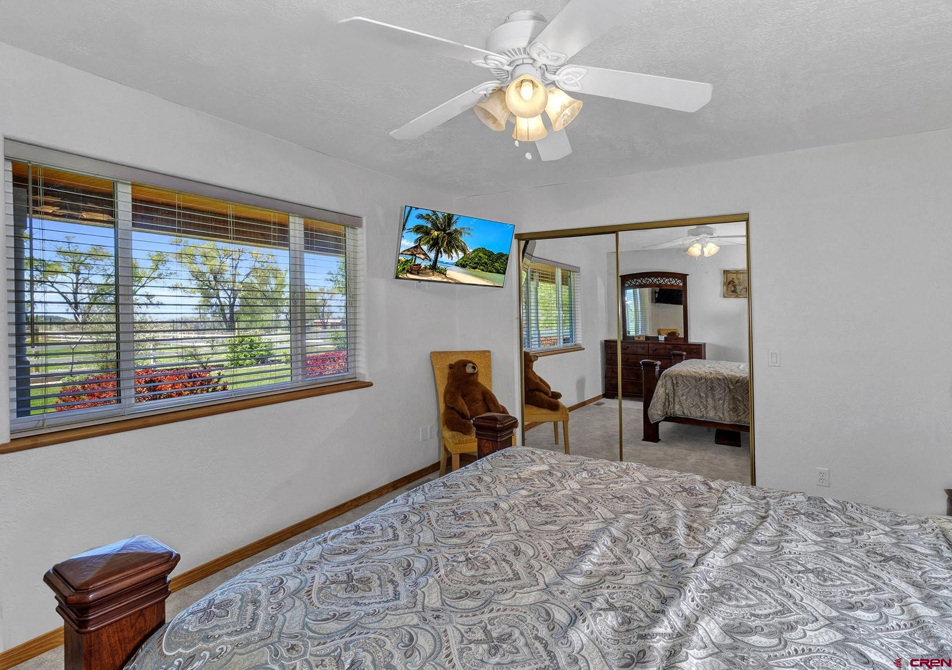 1036 East Main Street Cedaredge, CO 81413 - Photo 21 of 36 a bedroom with furniture and a window