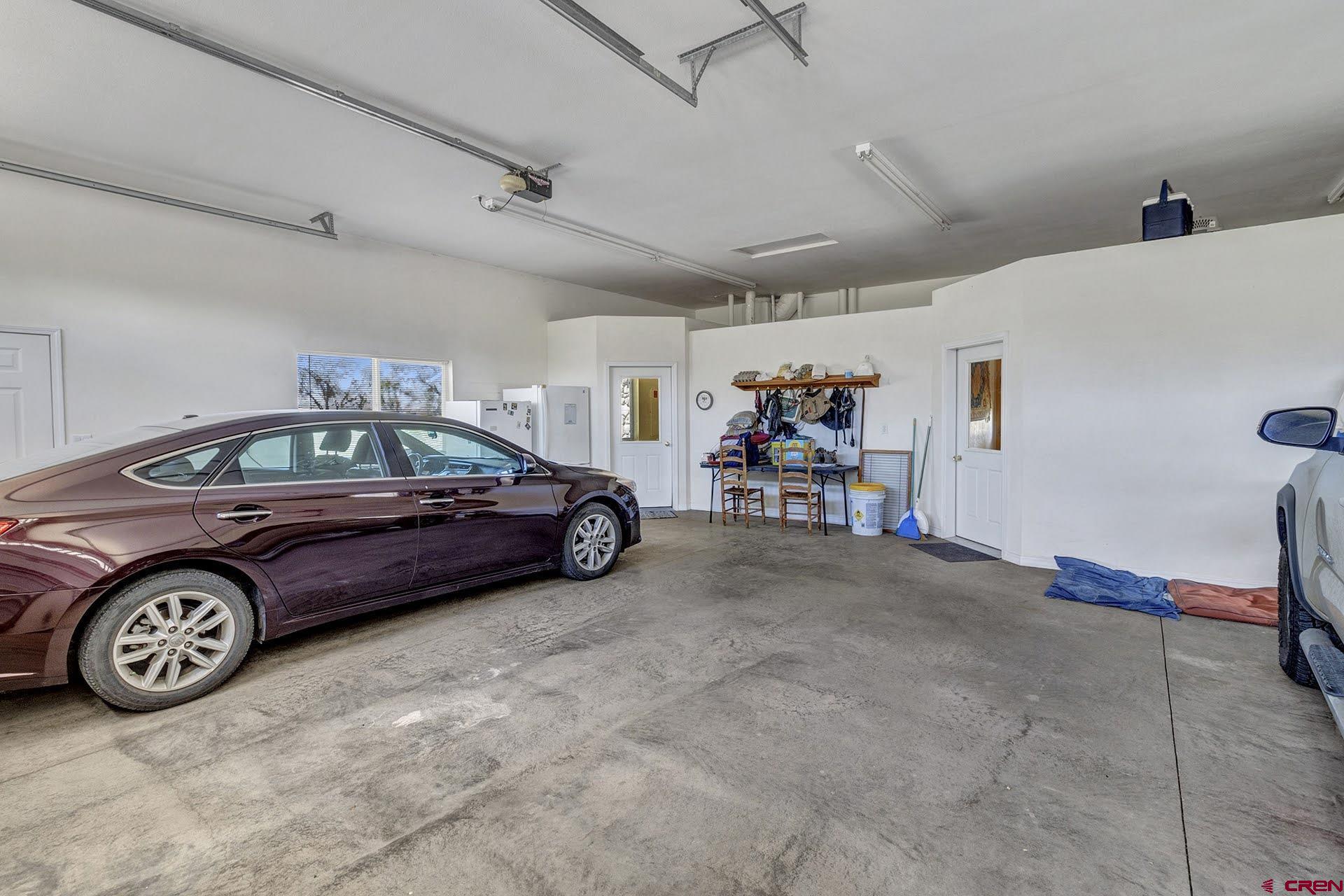 1036 East Main Street Cedaredge, CO 81413 - Photo 24 of 36 a car parked in a garage